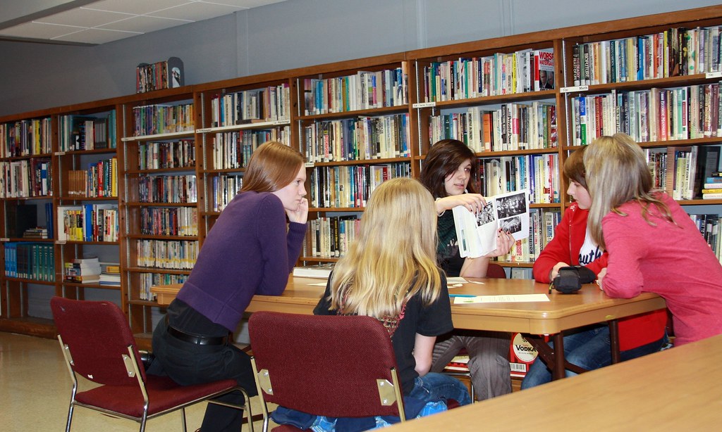 Teens meeting and talking in the library