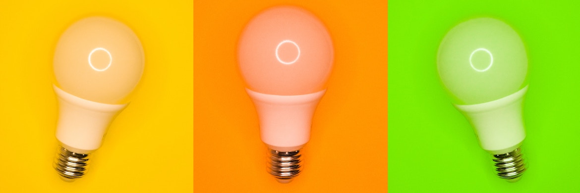 three light bulbs on colorful background