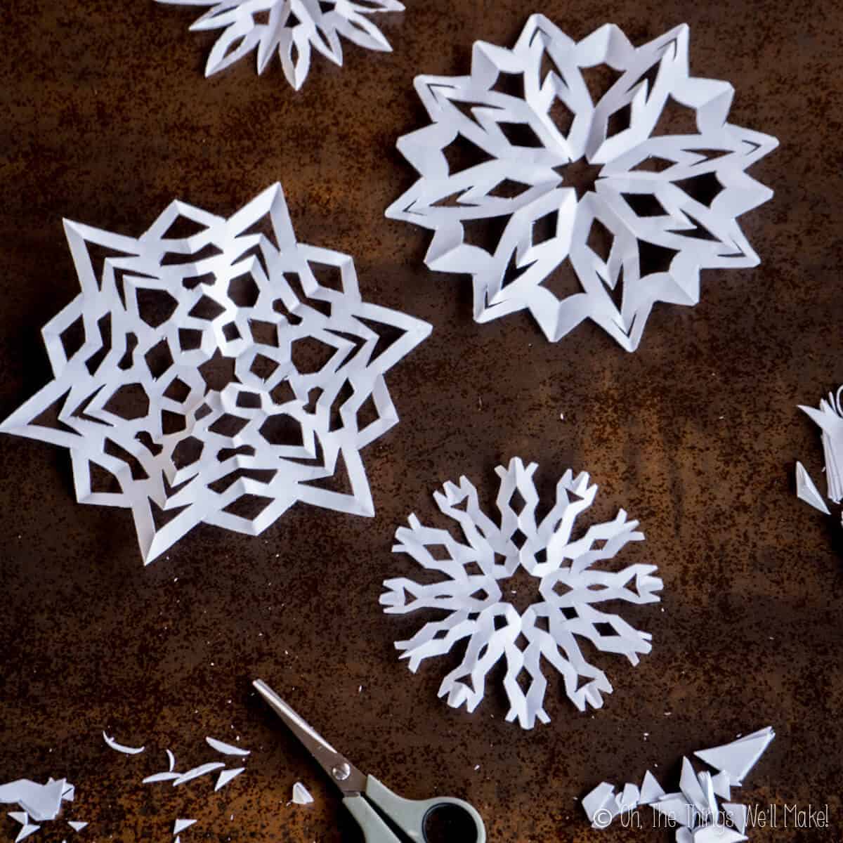 paper snowflakes and scissors