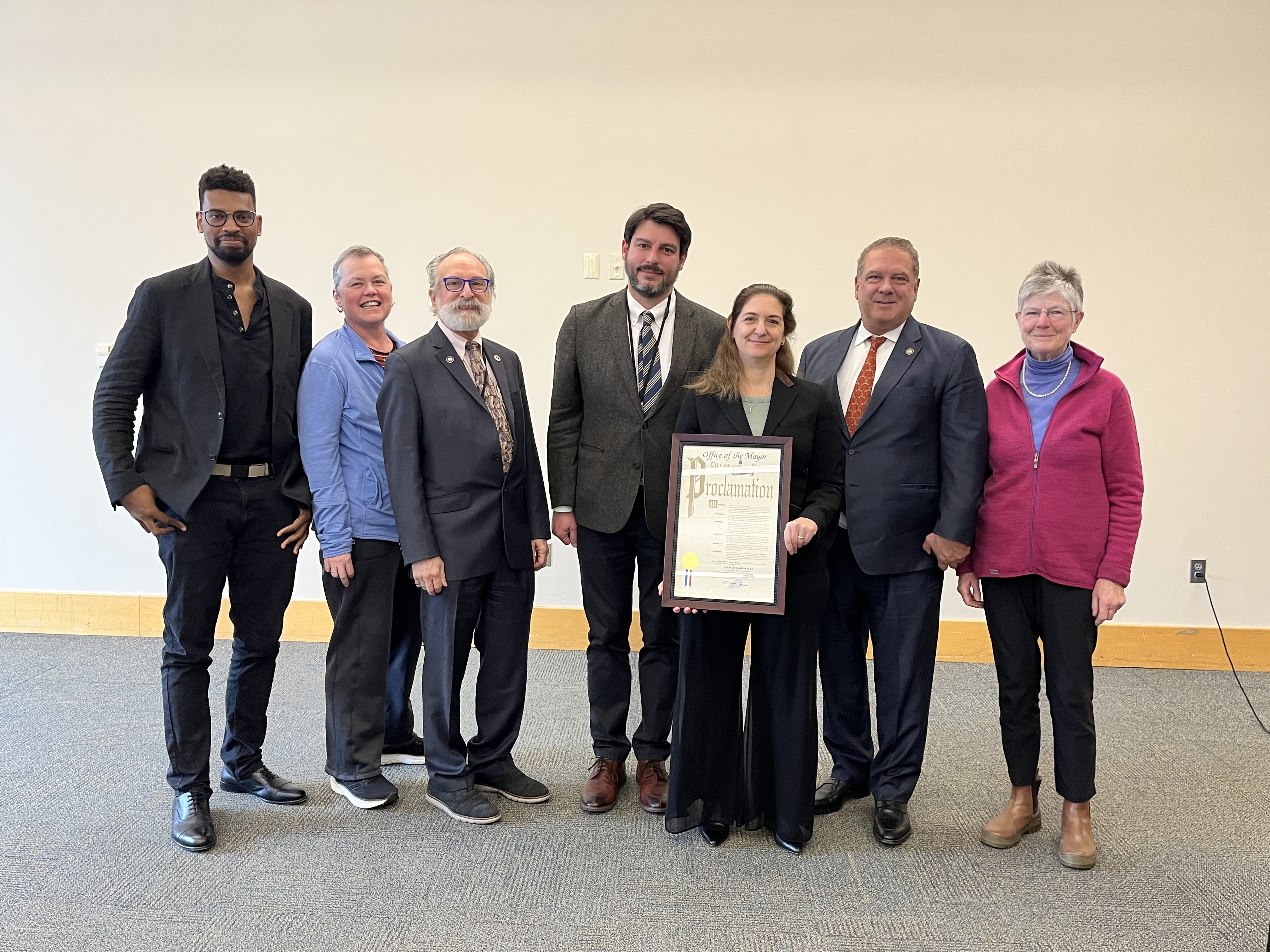 Trustees John Daily, Jr., Patricia Phelan, and Michael Sabatino, Library Director Jesse Montero, YPL Board President Nancy Maron, Mayor Mike Spano, and Jean Currie with award proclamation