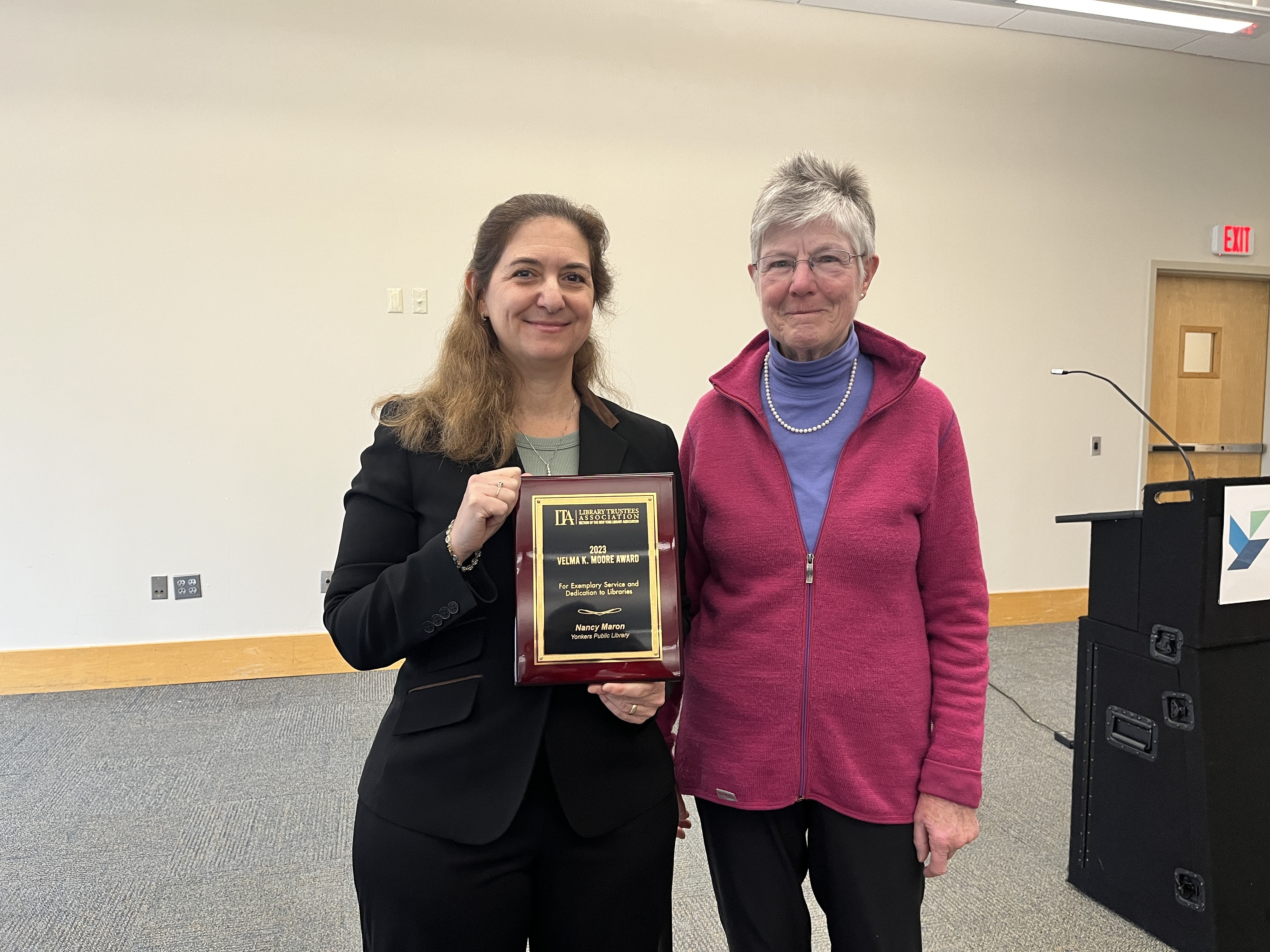Nancy Maron receiving the Velma K. Moore Award from Library Trustees Association President Jean Currie