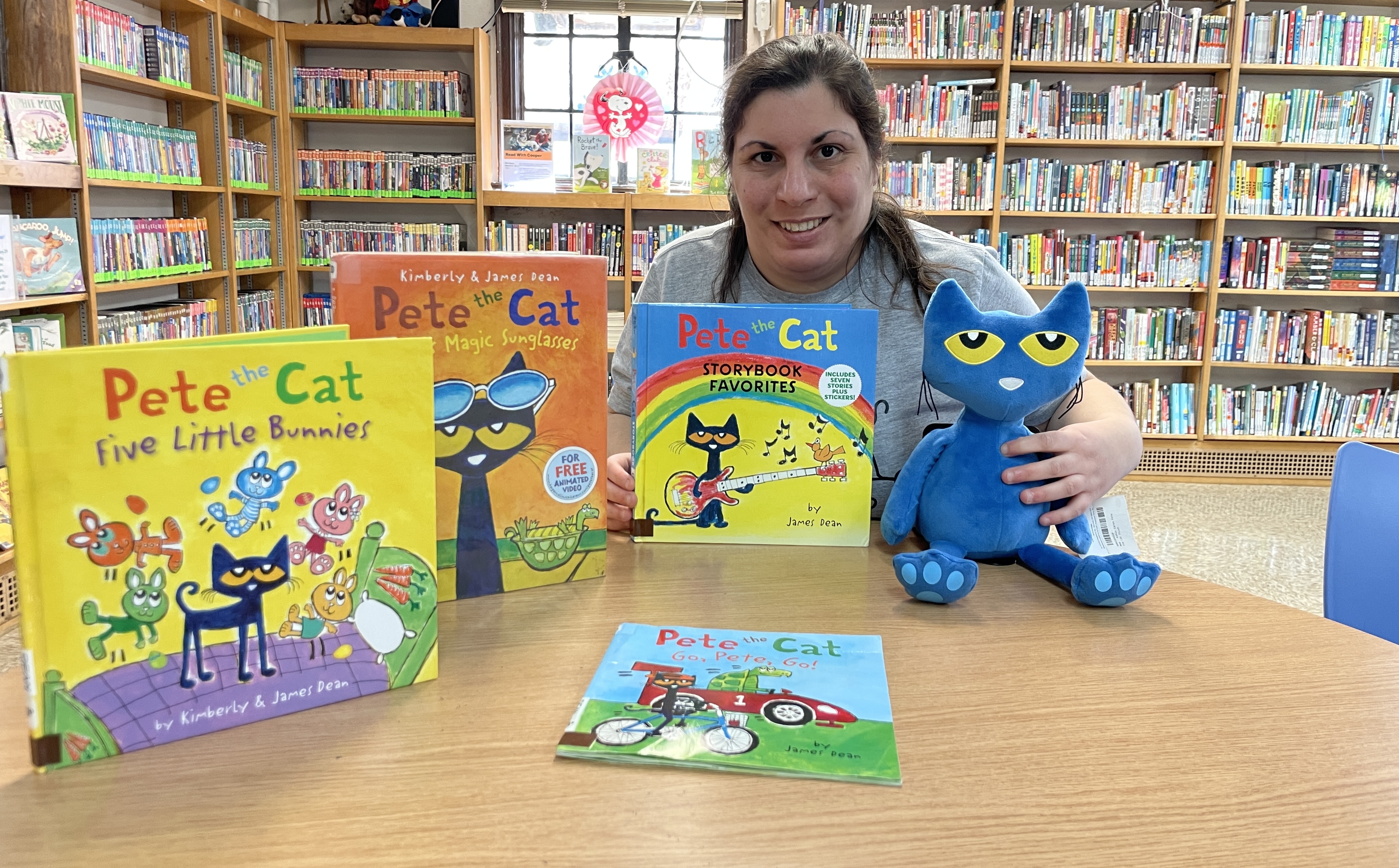 Image of Liz Caruso with Pete the Cat books and Pete Plushie