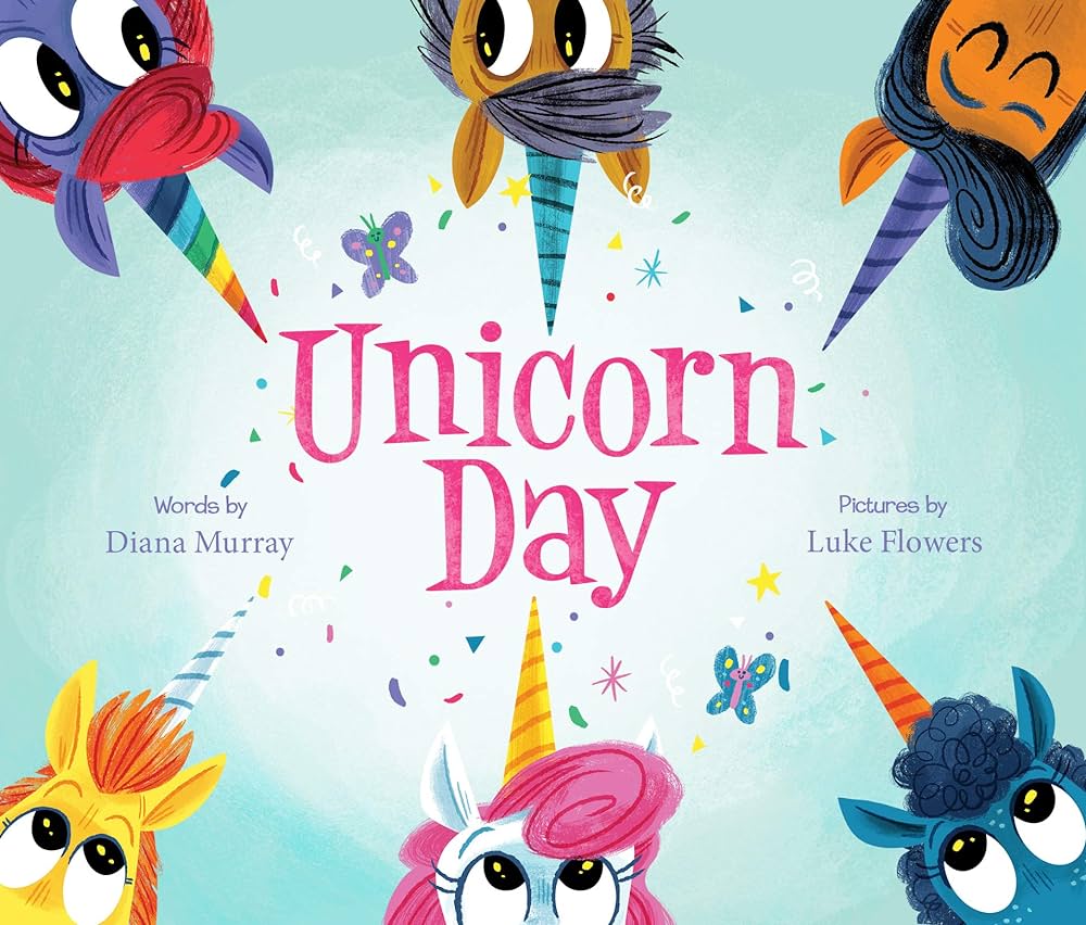 "Unicorn Day" written out and surronded by unicorn faces