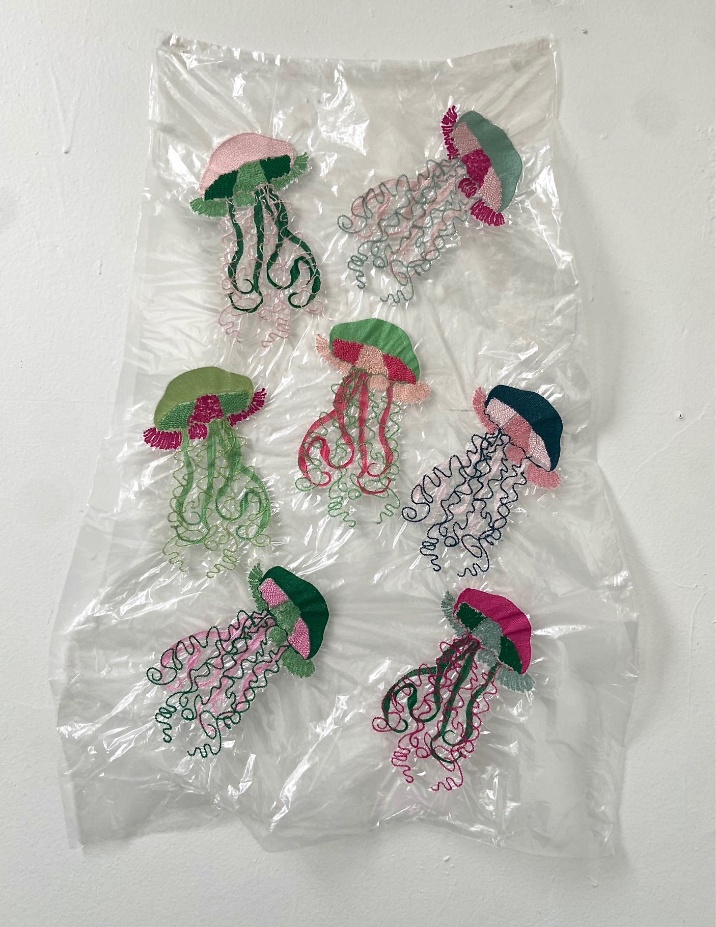 Polyester thread embroidery of jellyfish on plastic 