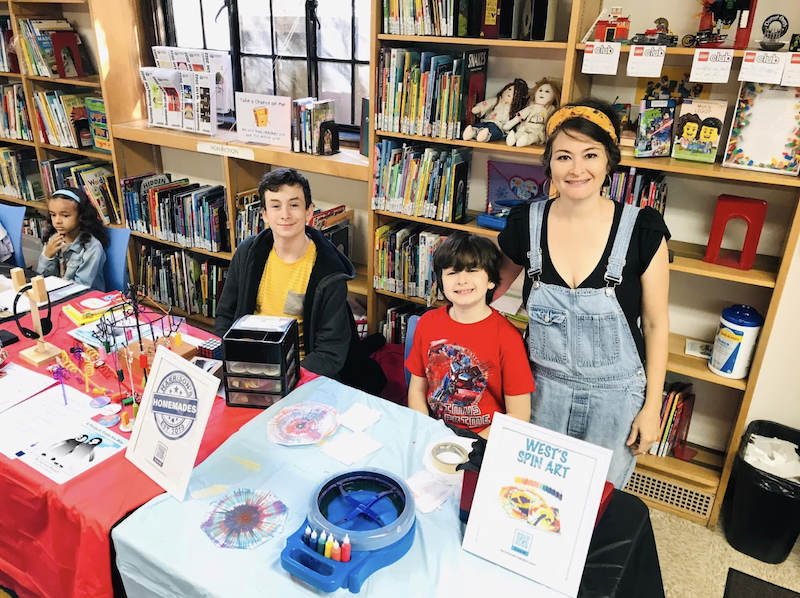 A photo of Tamra and her sons at the Holiday Bazaar.