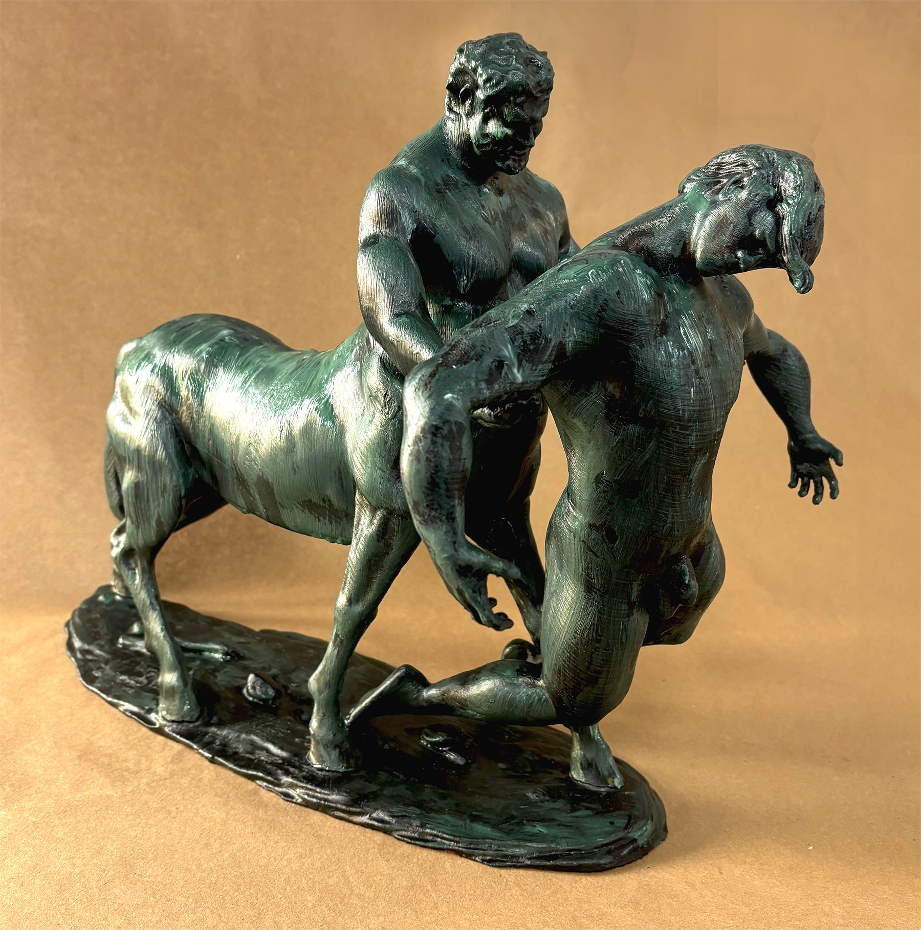 Resin sculpture resembling bronze depicting two male figures, one centaur and one human
