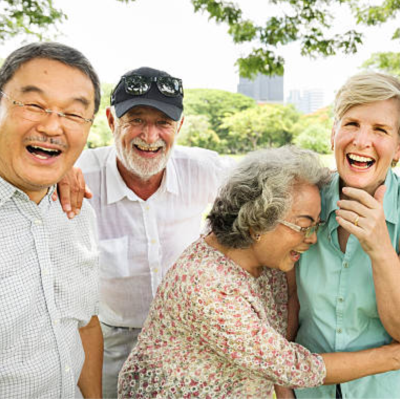 Four seniors hanging out laughing 