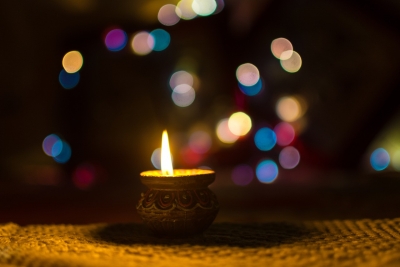 An oil lamp lit in celebration of Diwali.