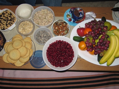 A table with several food dishes laid out to celebrate Yalda Night.
