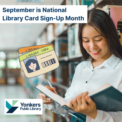 A woman reading a book in the library stacks.
