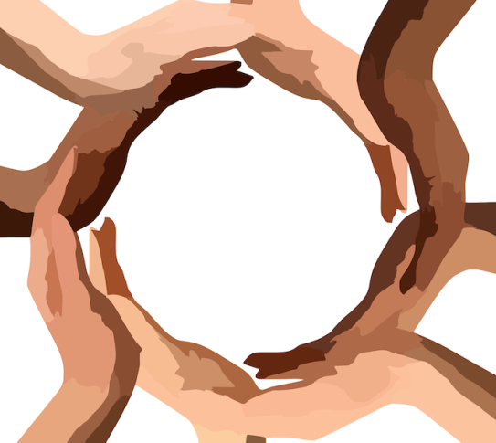 Hands of different skin tones in a circle. 
