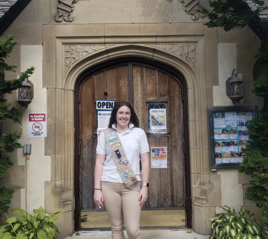 Girl Scount Alana outside of the Crestwood Library.