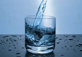 Image of water being poured into a glass