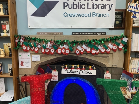 joy sign in front of Crestwood Library Fireplace