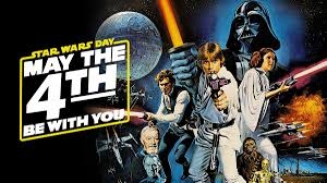 May the 4th be with you words over a moon light sabres, princess leia and darth vader