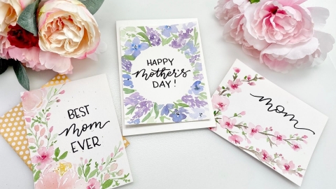 three cards for mother's day displayed with flowers