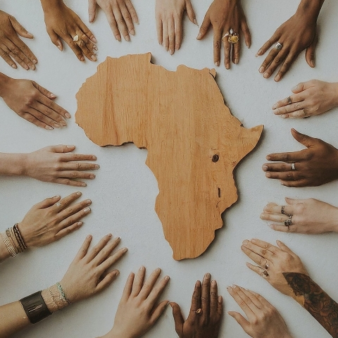 Hands reaching out to Africa