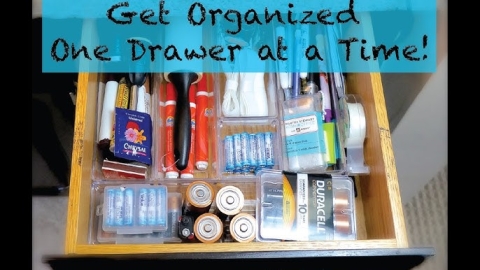 Get Organized One Drawer at a Time! words over an open drawer filled with supplies