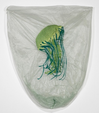 Blue and green embroidery of a jellyfish on plastic bag
