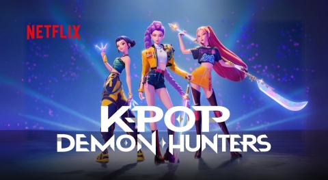Poster for K-Pop Demon Hunters featruing a group shot of Zoey, Rumi, and Mira posing with their weapons. The movie's logo is featured prominently in front of them, and the Netflix logo is smaller to their right.