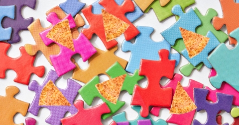 puzzle pieces with pizza interspersed into them