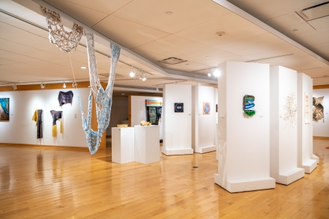 A full shot of the Sacred Threads installation in the gallery