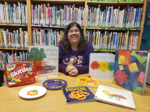 photo of nancy with a science experiment and books