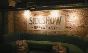 lounge scene with words speakeasy on the wall