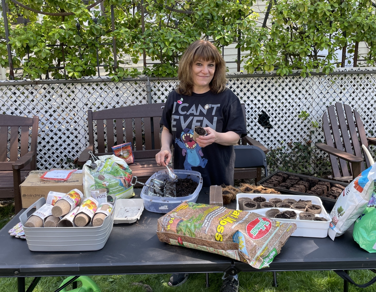 Jackie Leone planting seedling