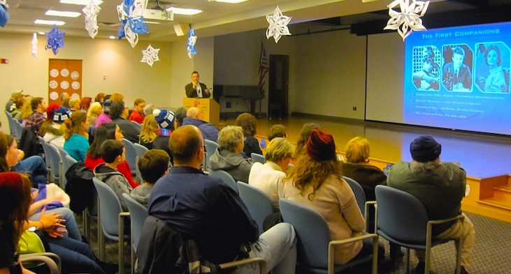 presenter clive young in front of an audience at a public library