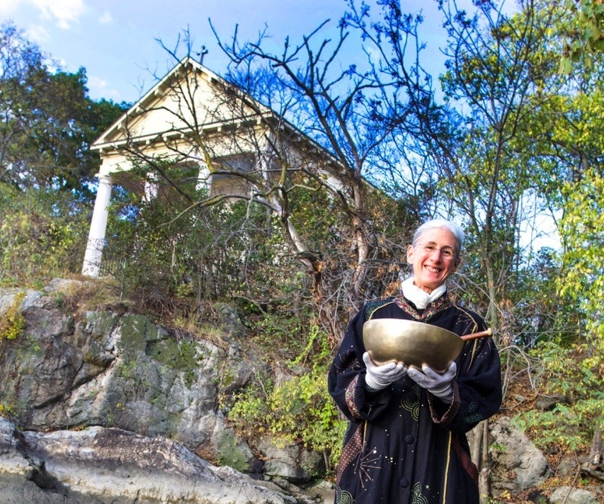 Image of Michelle Clifton holding a sound bowl