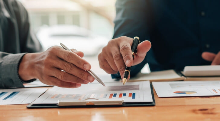 two people going over financial forms