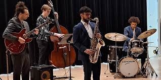 photo of teenagers playing instruments