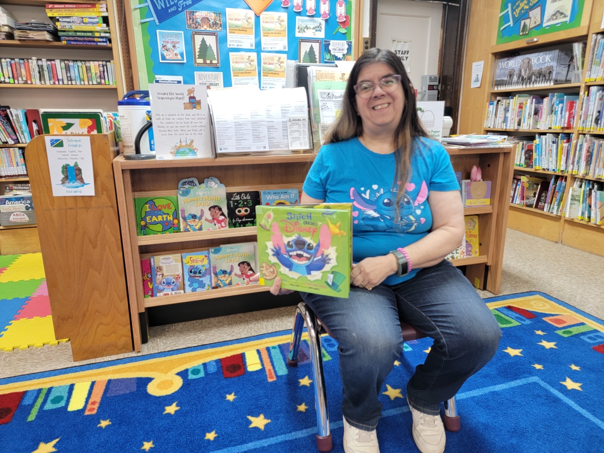 nancy holding stitch book