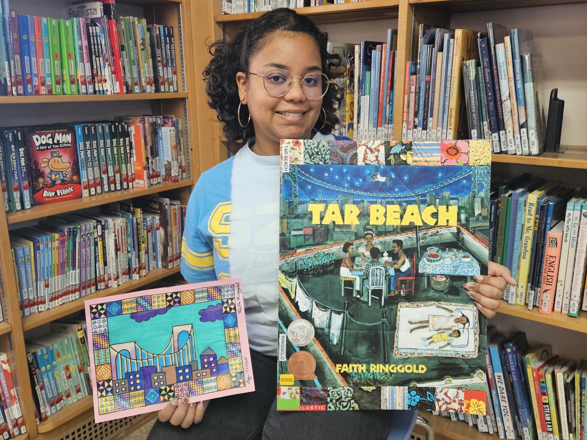 photo of say with books illustrated by Faith Ringgold