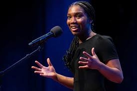 A young female teen performing a rap