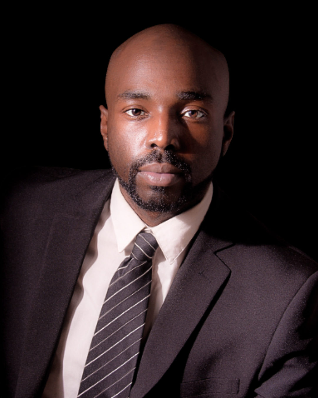 A photo of an African America man dressed in a suit