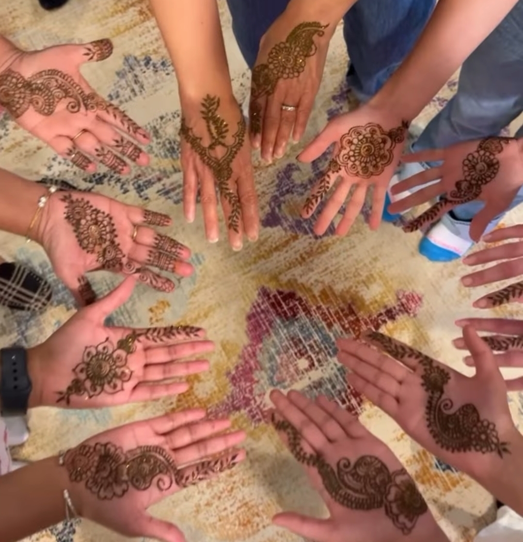 hands with henna designs on them