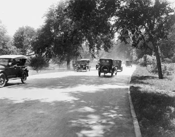 black and white photo of bronx river parkway with cars on it