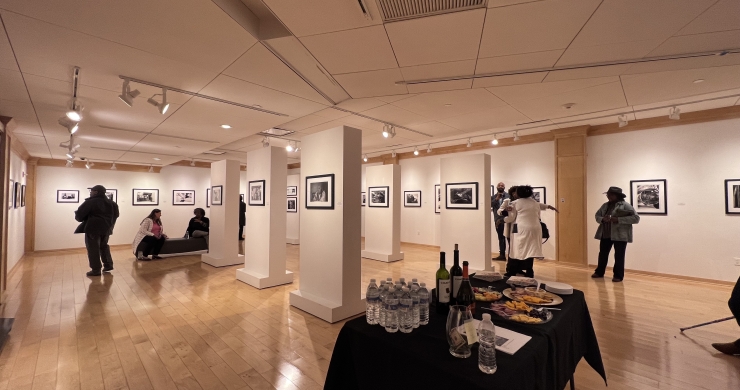 Zoomed out shot of the gallery with snack table during the Breathe In The Sky opening exhibition